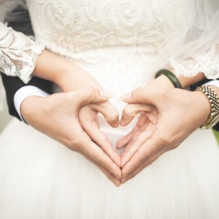Married-couple-with-heart-hands English couple