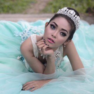 Bride-wearing-teal-dress-in-reclining-position Bride in teal